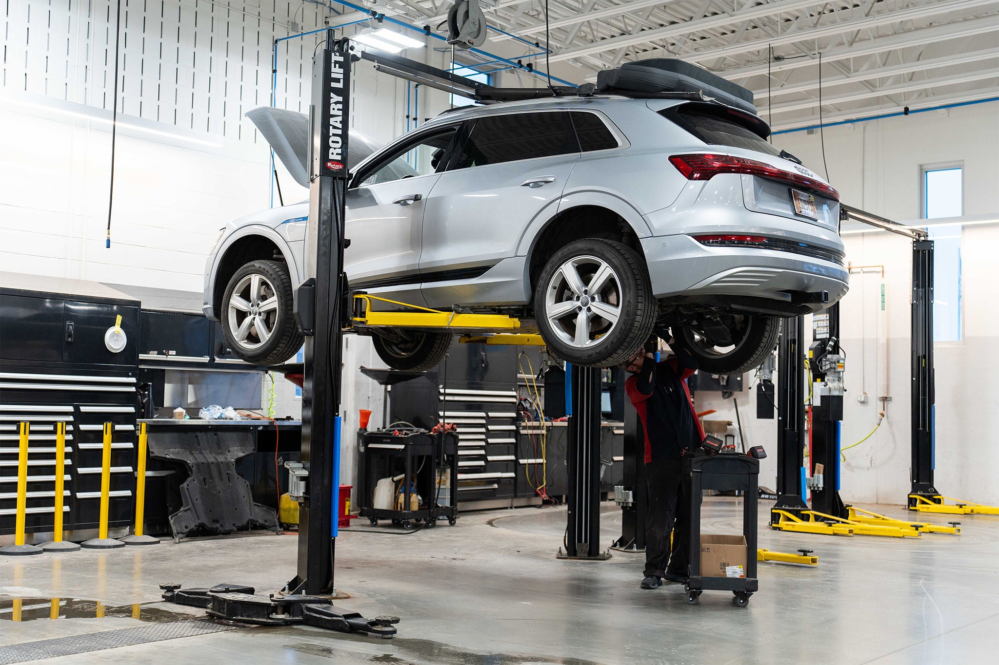 Audi Oil change service on Audi SUV lifted in service station at Audi Bozeman